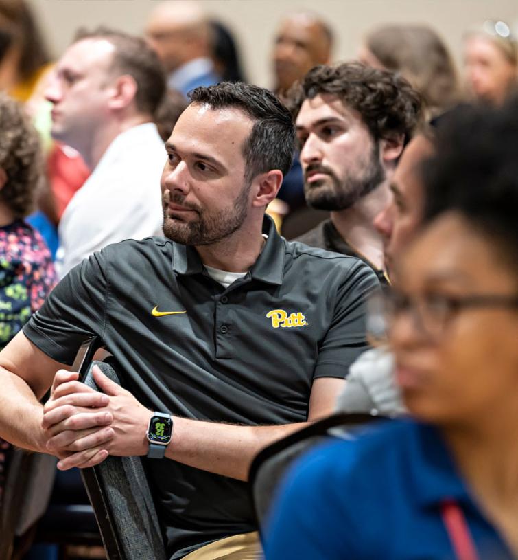 Pitt employees listen to important information at a workshop.