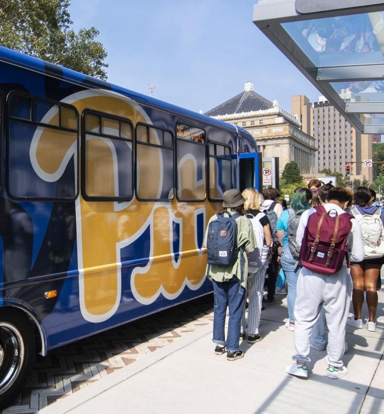 People getting onto Pitt Shuttle.